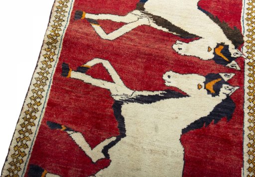 Backside of handmade 2000s Persian Gabbeh rug showing knot structure and weave density