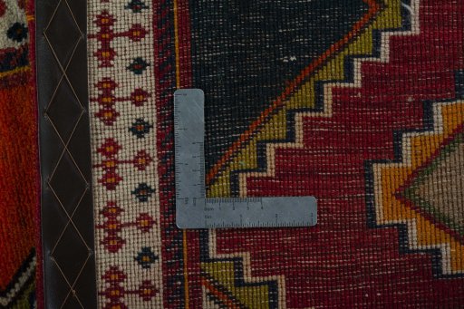 Corner detail of 2000s Persian Gabbeh rug showing border pattern and Wool pile