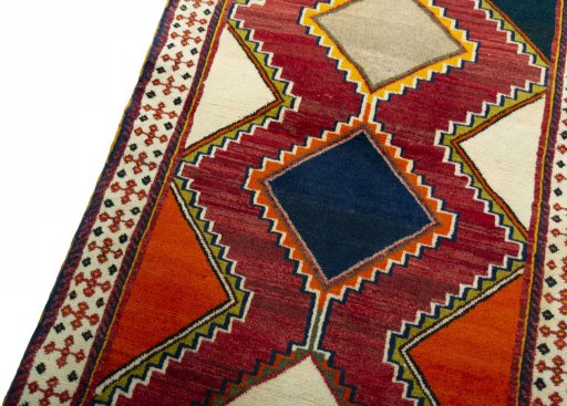 Backside of handmade 2000s Persian Gabbeh rug showing knot structure and weave density