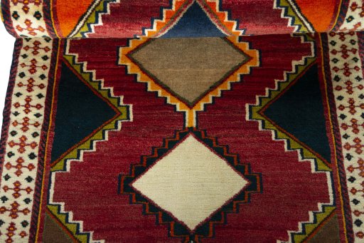 Full view of 2000s Persian Gabbeh rug from Iran / Persia, 155 × 80 cm in Red tones
