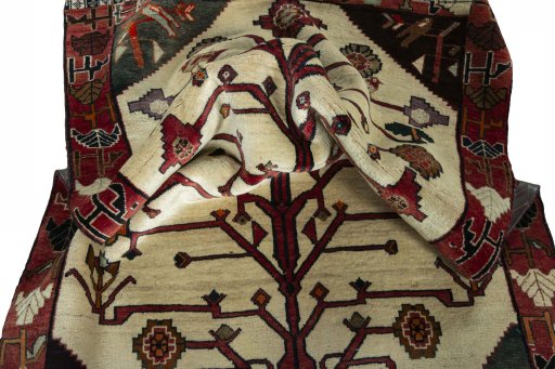 Corner detail of 2000s Persian Gabbeh rug showing border pattern and Wool pile