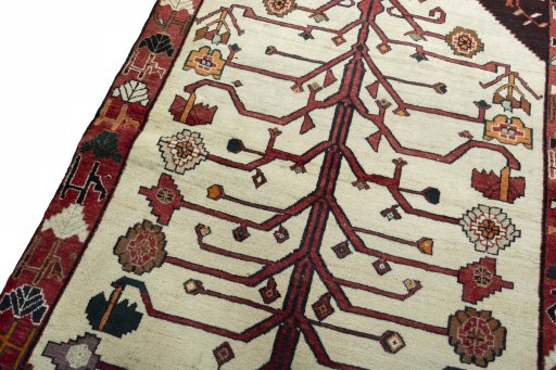 Backside of handmade 2000s Persian Gabbeh rug showing knot structure and weave density