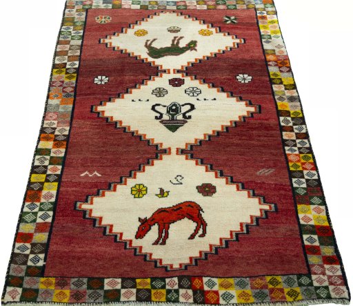 Surface texture of 2000s Persian Gabbeh rug with natural Wool and intricate pattern