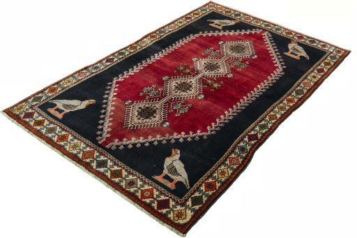 Corner detail of 2000s Persian Gabbeh rug showing border pattern and Wool pile