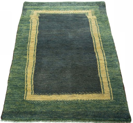 Surface texture of 2000s Persian Gabbeh rug with natural Wool and intricate pattern
