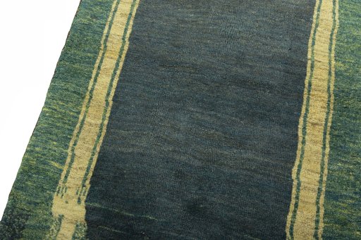 Backside of handmade 2000s Persian Gabbeh rug showing knot structure and weave density