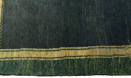 Close-up detail of 2000s Persian Gabbeh rug from Iran / Persia showing Wool weave