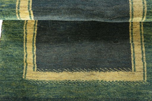 Full view of 2000s Persian Gabbeh rug from Iran / Persia, 134 × 85 cm in Green tones