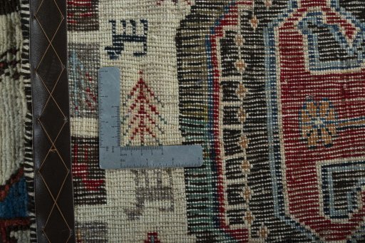 Corner detail of 2000s Persian Gabbeh rug showing border pattern and Wool pile
