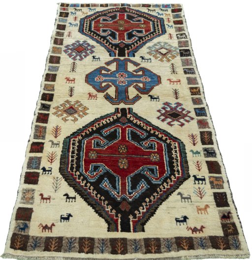 Surface texture of 2000s Persian Gabbeh rug with natural Wool and intricate pattern