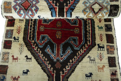Full view of 2000s Persian Gabbeh rug from Iran / Persia, 188 × 82 cm in Beige tones