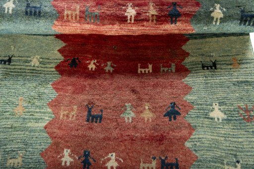 Full view of 1970s Persian Gabbeh rug from Iran / Persia, 183 × 121 cm in Red tones