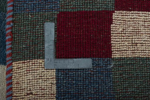 Close-up detail of 2000s Persian Gabbeh rug from Pakistan showing Wool weave