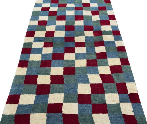 Surface texture of 2000s Persian Gabbeh rug with natural Wool and intricate pattern