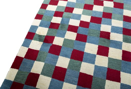 Backside of handmade 2000s Persian Gabbeh rug showing knot structure and weave density