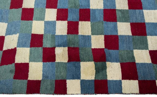 Close-up detail of 2000s Persian Gabbeh rug from Pakistan showing Wool weave