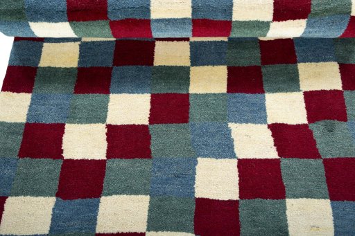 Full view of 2000s Persian Gabbeh rug from Pakistan, 186 × 111 cm in Multi Color tones