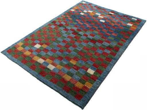 Corner detail of 2000s Persian Gabbeh rug showing border pattern and Wool pile