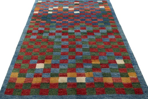 Surface texture of 2000s Persian Gabbeh rug with natural Wool and intricate pattern