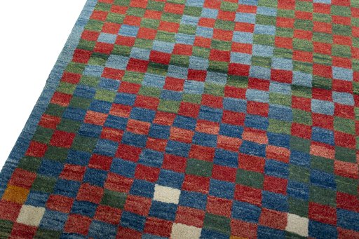 Backside of handmade 2000s Persian Gabbeh rug showing knot structure and weave density
