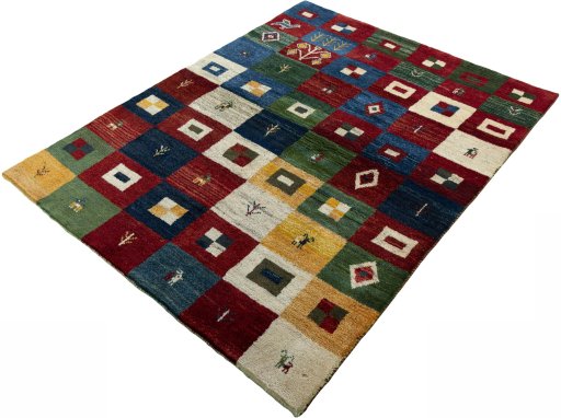 Corner detail of 2000s Persian Gabbeh rug showing border pattern and Wool pile
