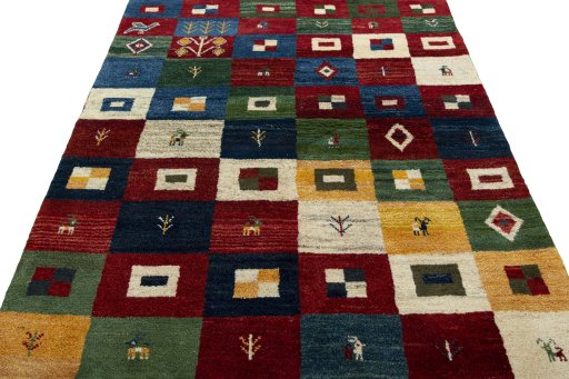 Surface texture of 2000s Persian Gabbeh rug with natural Wool and intricate pattern