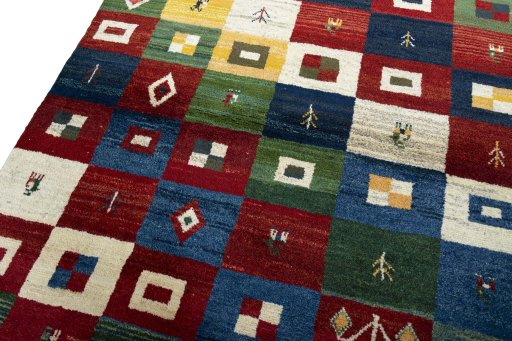 Backside of handmade 2000s Persian Gabbeh rug showing knot structure and weave density