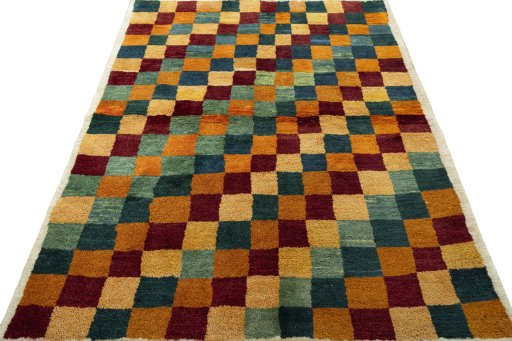 Surface texture of 2000s Persian Gabbeh rug with natural Wool and intricate pattern