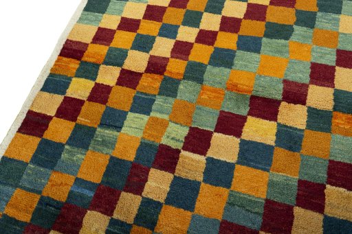 Backside of handmade 2000s Persian Gabbeh rug showing knot structure and weave density