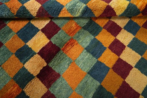 Full view of 2000s Persian Gabbeh rug from Pakistan, 196 × 148 cm in Multi Color tones