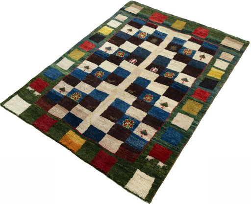 Corner detail of 2000s Persian Gabbeh rug showing border pattern and Wool pile