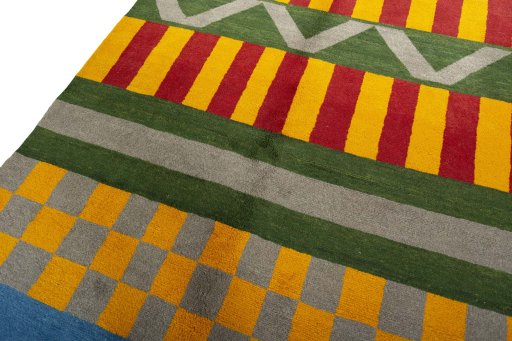 Backside of handmade New Persian Gabbeh rug showing knot structure and weave density