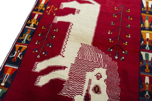 Backside of handmade 2000s Persian Gabbeh rug showing knot structure and weave density