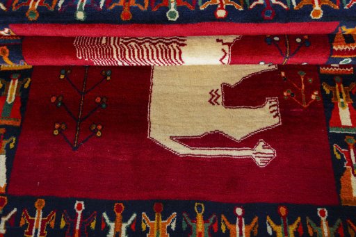 Full view of 2000s Persian Gabbeh rug from Iran / Persia, 185 × 131 cm in Red tones