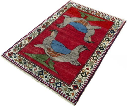 Corner detail of 2000s Persian Gabbeh rug showing border pattern and Wool pile