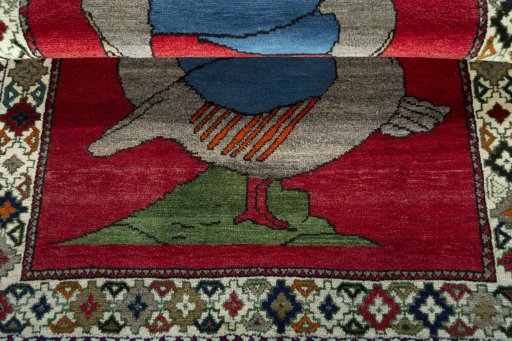 Full view of 2000s Persian Gabbeh rug from Iran / Persia, 145 × 100 cm in Red tones