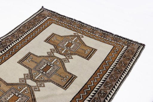 Surface texture of 2000s Persian Gabbeh rug with natural Wool and intricate pattern