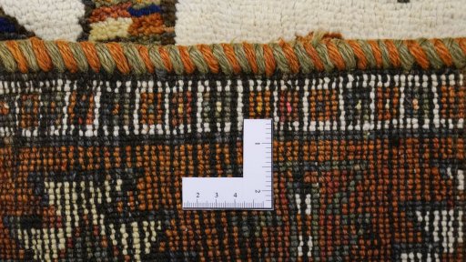 Corner detail of 1920s Persian Gabbeh rug showing border pattern and Wool pile