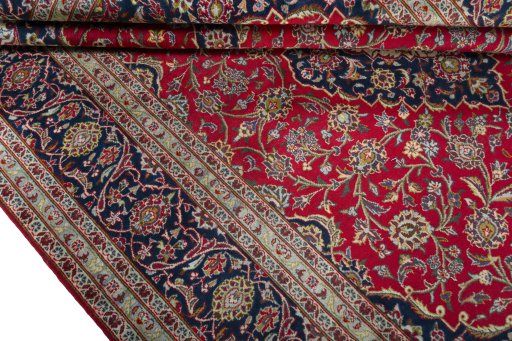 Close-up detail of 2000s Kashan rug from Iran / Persia showing Wool weave