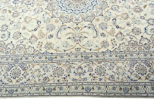Corner detail of 2000s Nain rug showing border pattern and Wool pile