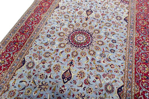 Backside of handmade 2000s Kashan rug showing knot structure and weave density