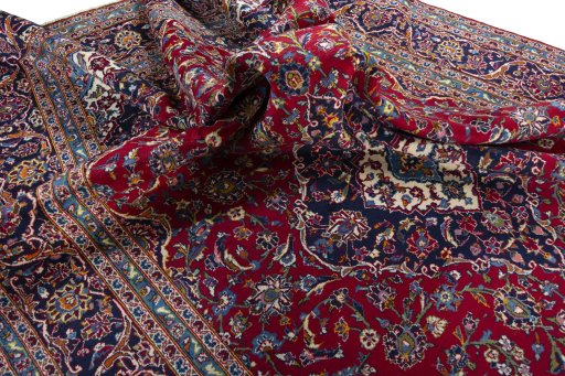Surface texture of 2000s Kashan rug with natural Wool and intricate pattern