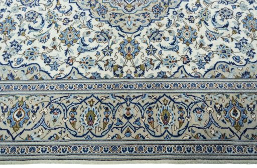Corner detail of 2000s Kashan rug showing border pattern and Wool pile
