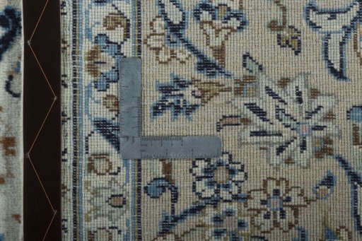 Backside of handmade 2000s Kashan rug showing knot structure and weave density