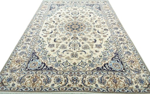 Surface texture of 2000s Nain rug with natural Wool and intricate pattern