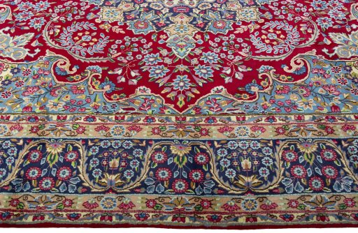 Corner detail of 1970s Kerman rug showing border pattern and Wool pile