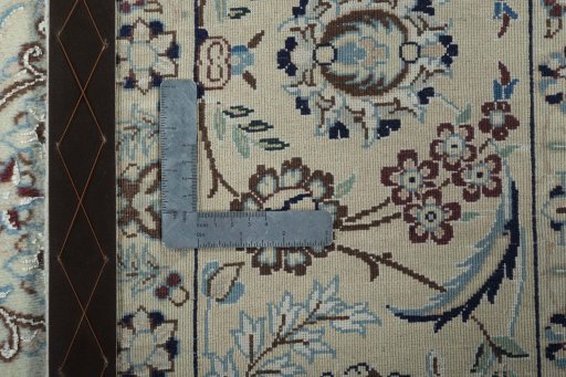 Backside of handmade 2000s Nain rug showing knot structure and weave density