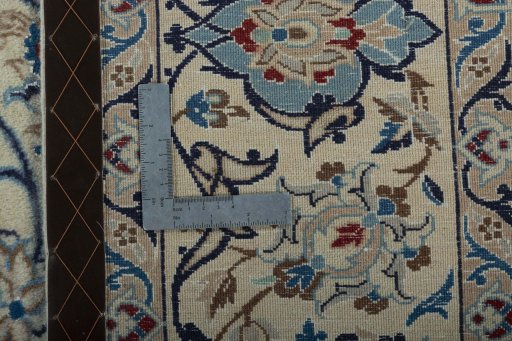 Backside of handmade 2000s Nain rug showing knot structure and weave density