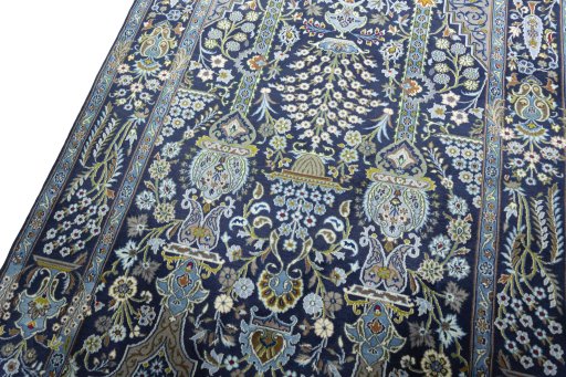 Backside of handmade 2000s Kashan rug showing knot structure and weave density