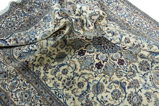 Surface texture of 2000s Nain rug with natural Wool and intricate pattern